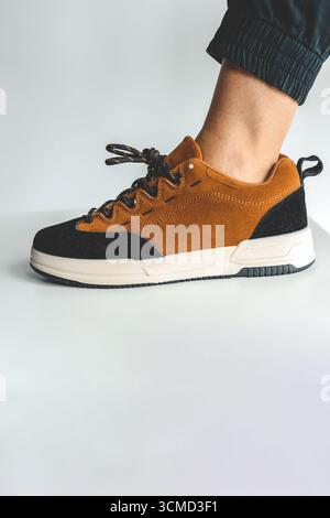 Advertising men's shoes, close-up on the foot. Stock Photo