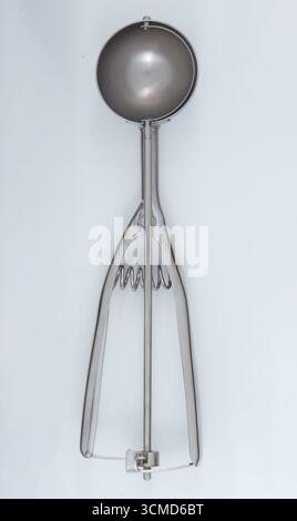 Stainless steel ice cream scoop isolated nature background with clipping path Stock Photo