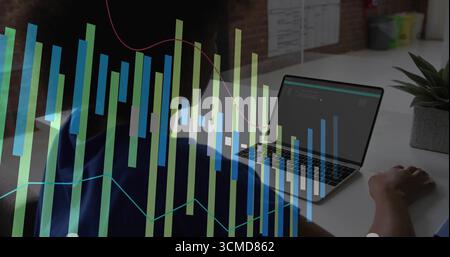 Coding female developer analyzing metrics on laptop at office desk, with data visualization overlay Stock Photo