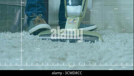 Gliding stick vacuum head pressing into shag carpet in hallway, with denim jeans and grey sneakers Stock Photo