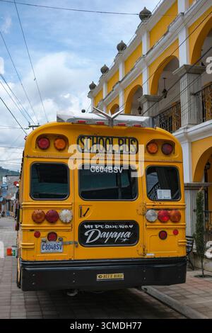 Santa Catarina Barahona, Guatemala - June 28, 2025: Chicken bus, a typical Central American passenger bus, on a street in Santa Catarina Barahona. Stock Photo