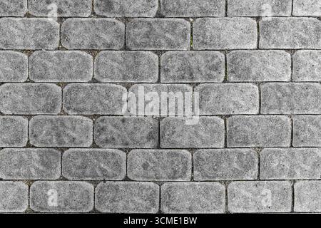 Stone paved street, view from above. Beautiful background. Stone pavement texture. Stock Photo