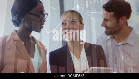 Reviewing three business professionals analyzing tablet finance data in office, candlestick overlay Stock Photo