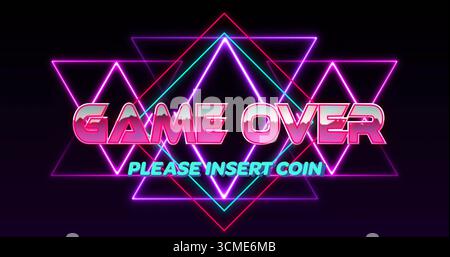 Displaying neon GAME OVER and PLEASE INSERT COIN text on arcade screen, with neon triangles Stock Photo