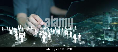 Hand connecting global people network with digital icons, symbolizing human resources, customer relationship management, teamwork, and modern business Stock Photo
