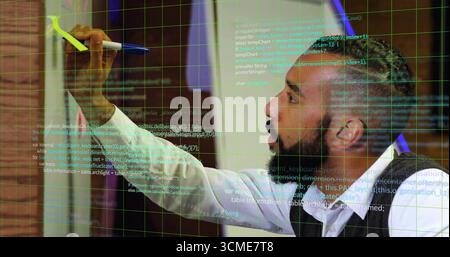 Sketching man in vest coding on glass board in office, with floating code snippets, copy space Stock Photo