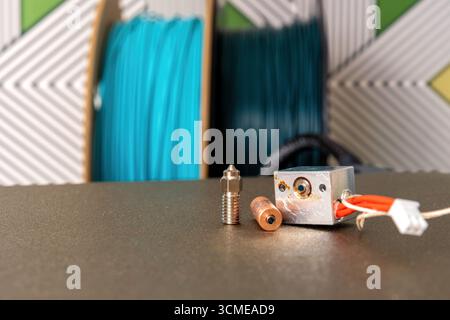 Broken heat break on the 3d printer hot end and nozzle. Industrial equipment maintenance. Engineering and technology Stock Photo