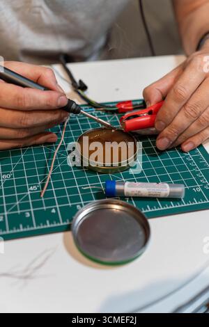 Electronic maintenance with soldering iron, wires, and tools Stock Photo