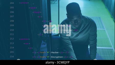 Kneeling IT technician inspecting server rack in data center, with cables and HTML tags, copy space Stock Photo