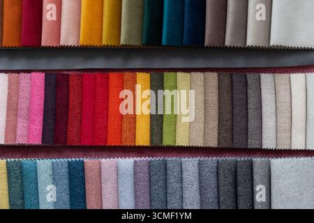 A selection of upholstery fabric samples in various textures and colors. The image represents the planning and material selection phase for interior d Stock Photo