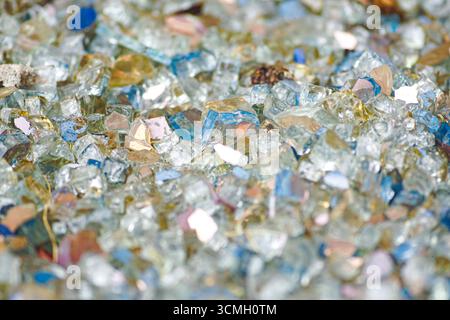 Multicolored glass fragments close-up. Ideal for craft backgrounds, mosaic inspirations and art concepts. Recycled material design and handmade decor Stock Photo