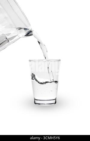 Hand pouring water from glass plastic jug isolated on white. Stock Photo