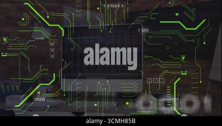 Showing flat-screen monitor with code, neon circuit graphics and binary digits on office desk Stock Photo