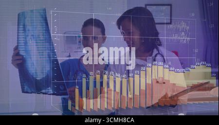 Two medical professionals examining chest X-ray in exam room with 3D bar graph and line chart Stock Photo