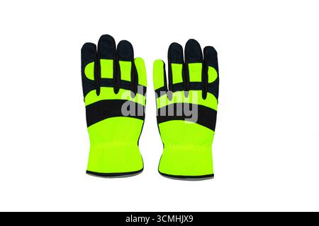 Protective work gloves on a white background, green - black with black leather and green synthetic material. Stock Photo