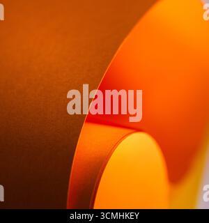 texture Curved orange paper abstract composition with bold geometric shapes and vibrant warm tones. Minimalist macro image ideal for design templates, Stock Photo