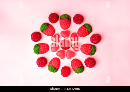 Colorful gummy candies arranged in a flower shape are creating a cheerful and playful scene Stock Photo