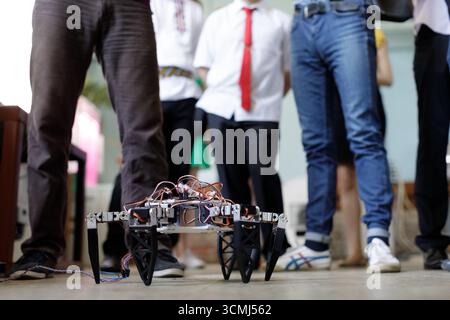 Legged robot prototype tested by students in a STEM workshop, showing teamwork, innovation, and education in action Stock Photo