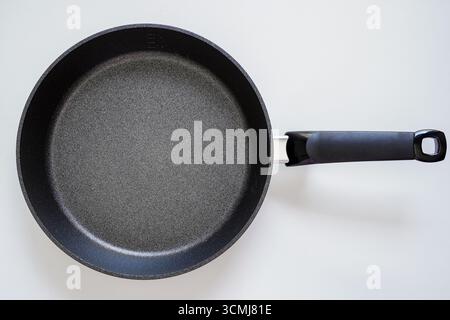 Easy-to-cook coated frying pan on white background Stock Photo