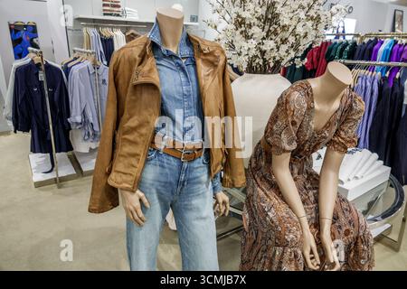 Aventura Mall Miami Florida,inside interior shopping,Bloomingdale's department store,mannequin dressed in denim leather jacket,display mannequin weari Stock Photo