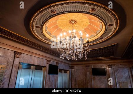 The Winter Garden theatre has a decorative chandelier in its entrance lobby, 2025, New York City, USA Stock Photo