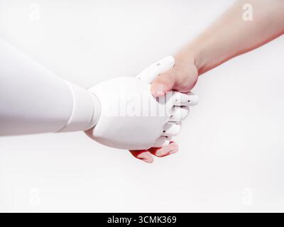 Human hand shakes robot's hand Stock Photo