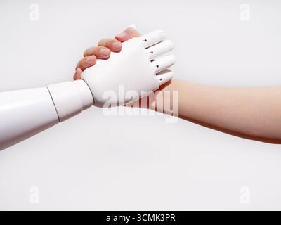 Human hand shakes robot's hand Stock Photo