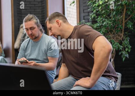 Business project team working together at meeting room at office. Programmers working in the office of a software development company. Coding Stock Photo