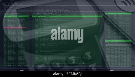 Displaying green-tinted terminal interface over dim desk, showing code view, tables and headphones Stock Photo