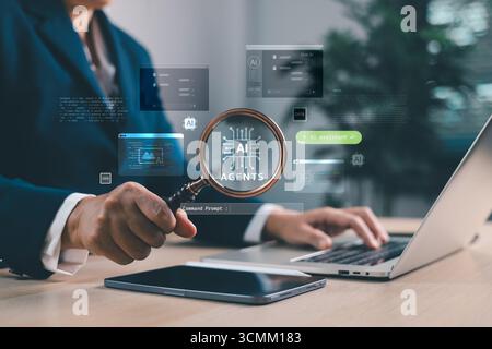 Businessman analyzing AI agents with magnifying glass and laptop. Artificial intelligence for chatbots, automation, data analytics and digital transfo Stock Photo