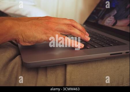 Closeup of man hand using laptop Stock Photo