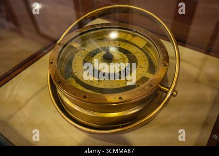 Old brass compass displayed in bandirma ferry museum ship. Antique compass from bandirma ship. Historical navigation instrument on exhibit Stock Photo