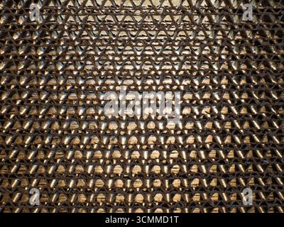Close-up of multi-layer cardboard material illuminated from the back by sunlight. Background Stock Photo