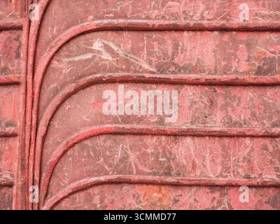 Repeated curves pattern of old stacked plastic chairs Stock Photo