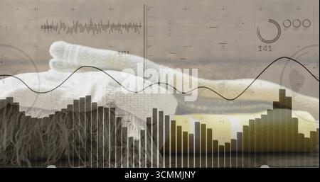 Displaying folded knit blankets with cable pattern resting on wooden tabletop, data charts overlay Stock Photo