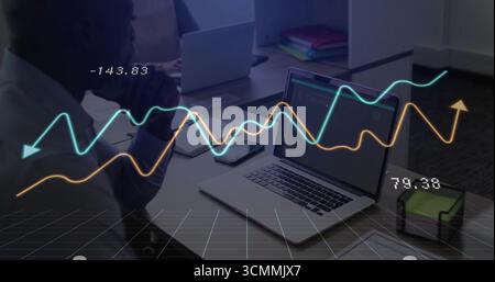 Businessman studying coded data on laptop at office, with line-graph overlay, copy space Stock Photo