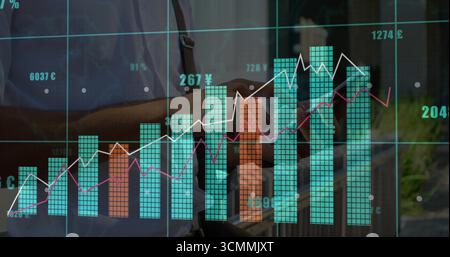 Displaying transparent financial dashboard on city plaza window, with teal bars and numeric labels Stock Photo