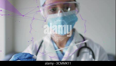 Holding sterile swab, doctor wearing nitrile gloves in testing room, with holographic head network Stock Photo