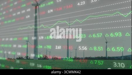Wind turbines standing in wind farm, with red green stock quotes, arrows and green line graph Stock Photo