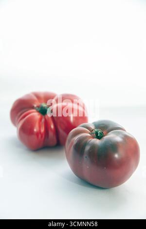 red beef tomato photographed in studio. White background. Stock Photo