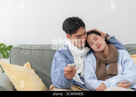 Winter day finds happy family couple, people enjoying cozy home indoor comfort, relaxing together on Stock Photo