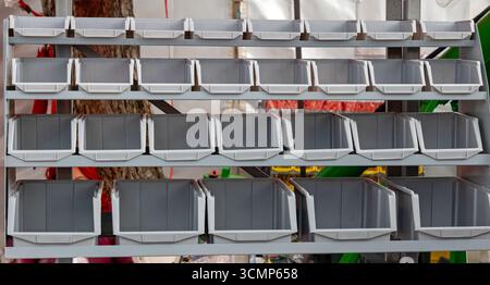 Empty plastic box container crates organizer on a shelf Stock Photo