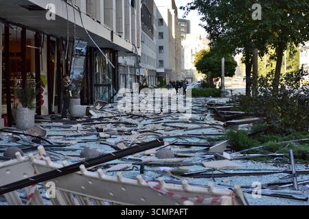 Kyiv, Ukraine. 28th Aug, 2025. People are standing near a pile of glass facade panels from a building, shattered during a combined Russian strike. (Photo by Aleksandr Gusev/SOPA Images/Sipa USA) Credit: Sipa USA/Alamy Live News Stock Photo