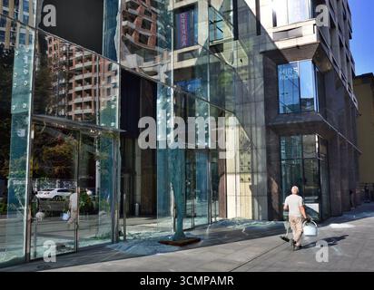 Kyiv, Ukraine. 28th Aug, 2025. Men walk past a pile of glass facade panels from a building, shattered during a combined Russian strike. (Photo by Aleksandr Gusev/SOPA Images/Sipa USA) Credit: Sipa USA/Alamy Live News Stock Photo