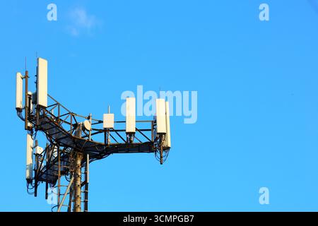 Cell Tower Against a Clear Blue Sky Stock Photo