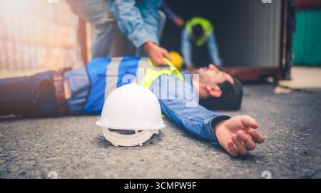 Engineer or foreman has an accident while working on Container ship. Logistics global import or export shipping industrial concept. Stock Photo