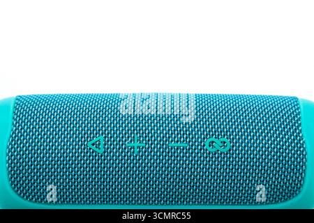 New wireless music speaker on a white background, turquoise. Stock Photo