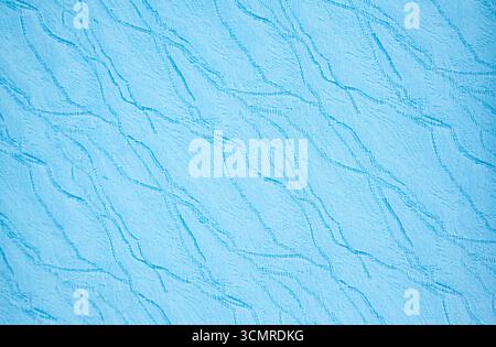 Texture of blue fabric with a wavy pattern. Stock Photo