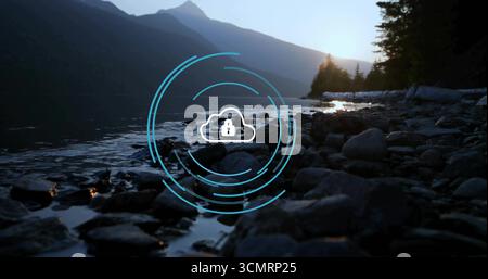 Displaying digital cloud icon with padlock hovering over lake shore at dawn, pines, blue data rings Stock Photo