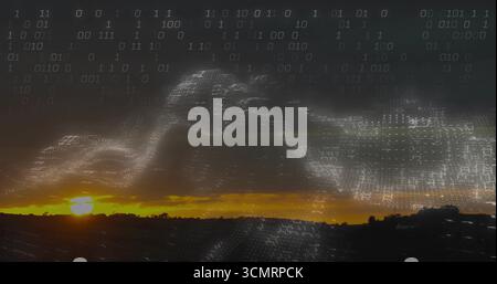 Streaming binary code wave forming data overlay across rural dusk sky, with sun glow over hills Stock Photo